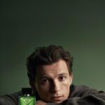 Tom Holland with Prada Green perfume bottle